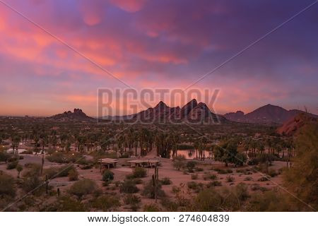 Stunning sunset over Phoenix, Arizona, Papago Park in foreground.