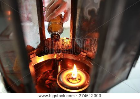 Buddhists Make Merit,oil Fill In A Lamp For Lighting And For Use In Incense. Means To Make Life Smoo