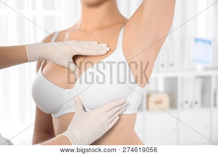 Doctor Checking Woman's Breast At Hospital, Closeup