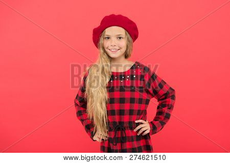 Wear Beret Like Fashion Girl. Kid Little Cute Girl With Long Blonde Hair Posing In Beret Hat And Che