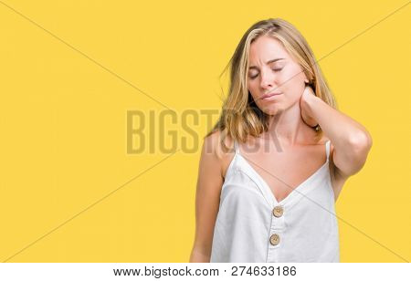 Beautiful young woman over isolated background Suffering of neck ache injury, touching neck with hand, muscular pain