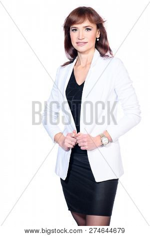A portrait of a beautiful woman wearing classic clothes and posing over the white background in the studio. 