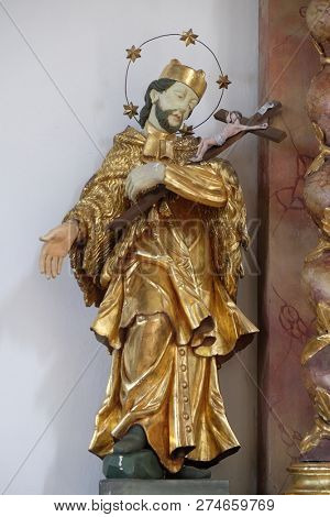 RETZBACH, GERMANY - JULY 04, 2018: Saint John Nepomuk statue on the Holy Family altar in Maria im Grunen Tal pilgrimage church in Retzbach in the Bavarian district of Main-Spessart, Germany