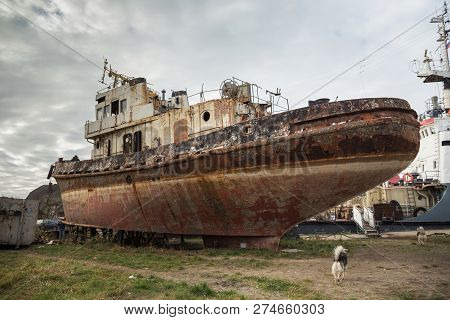 Rusty Decommissioned Marine Ship That Was Left On The Shore.