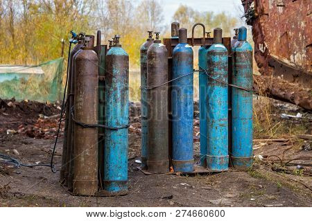 The Several Blue Old Liquefied Gas Cylinders.