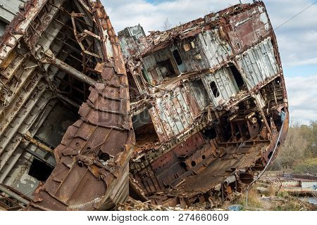 Huge Rusty Pieces Of Decommissioned Marine Ship That Was Cut And Left On The Shore.