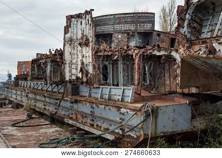 Huge Rusty Pieces Of Decommissioned Marine Ship That Was Cut And Left On The Shore.