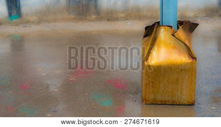 The Tin Panel Of A Piler And A Puddle