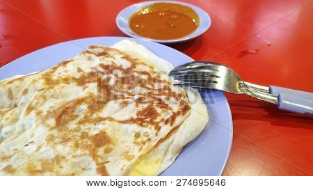 Roti Canai Or Roti Prata With Curry Sauce