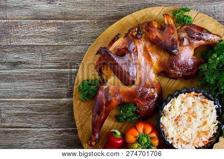 Whole Baked Flattened Chicken With A Golden Crispy Crust With Fresh Vegetables, Herbs And Cabbage Sa