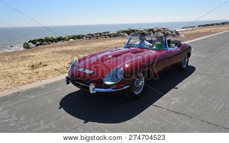 Felixstowe, Suffolk, England -  May 07, 2017: Classic Red Jaguar  E  Type Convertible Motor Car Bein