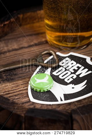 London, Uk - August 10, 2018: Brewdog Beer Coaster With Bottle Top And Opener And Glass Of Beer On T
