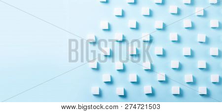 Sugar Cubes Regular Pattern On Blue Background, Flat Lay Banner With Copy Space
