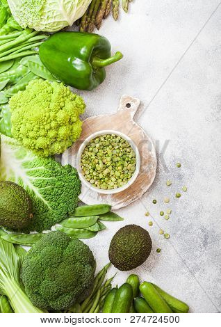 Assorted Green Toned Raw Organic Vegetables On White Background. Avocado, Cabbage, Broccoli, Caulifl