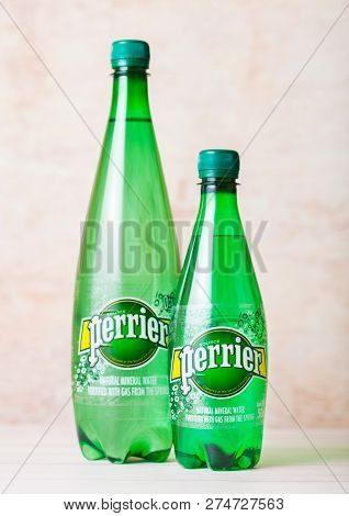 London, Uk - September 03, 2018: Bottles Of Perrier Sparkling Water On Wooden Background. Perrier Is
