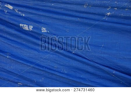 Blue Fabric Texture From Crumpled Worn Tarp Covering