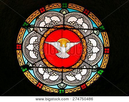 Antibes, France - November 16, 2018: Stained Glass In The Church Of Antibes, France, Depicting A Dov