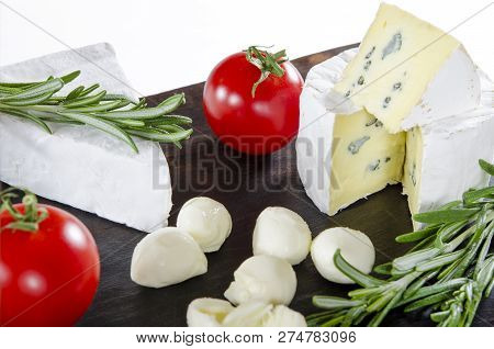 Tasting Cheese Dish With Tomatos On Old Black Dask. Food For Wine And Romantic, Cheese Delicatessen.
