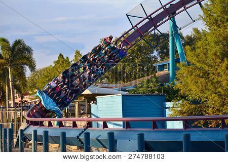 Orlando, Florida. November 19, 2018. Nice People Enjoying Mako Rollercoaster On Lightblue Cloudy Bac