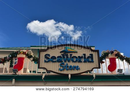 Orlando, Florida. November 19, 2018. Information And Reservation Sign And Christmas Ornaments On Lig