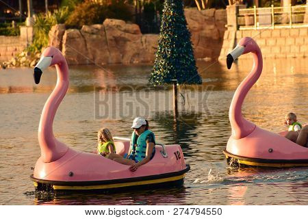 Orlando, Florida. November 19, 2018. Information And Reservation Sign And Christmas Ornaments On Lig