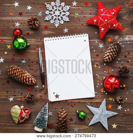 Christmas And New Year Background With Notepad, Pen And Decorati