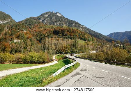 Winding Mountain Road Near The Municipality Of Schneizlreuth. View Of The Alps. District Of Berchtes