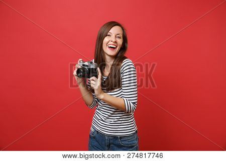 Portrait Of Laughing Young Woman In Casual Striped Clothes Holdi