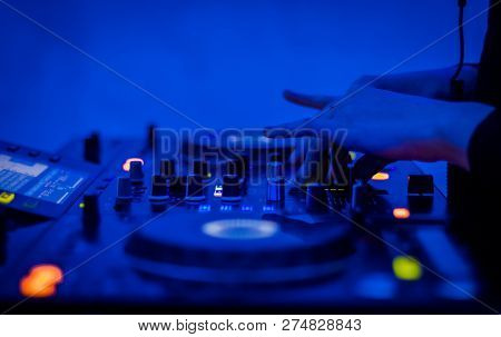 Dj Mixer. Women's Hands Twist Toggle Switches