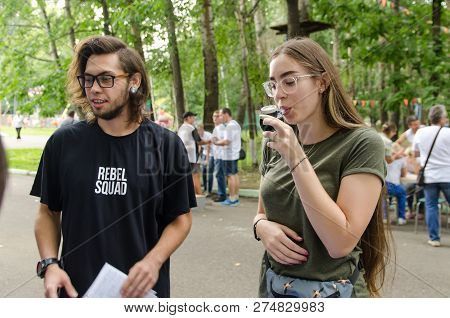 Komsomolsk-on-amur, Russia - August 19, 2018. Attractive Girl Blows Into Device To Measure Lung Volu