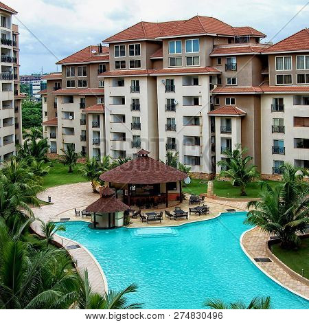 Modern Residential Buildings In Africa With An Outdoor Cafe And A Beautiful Swimming Pool Surrounded