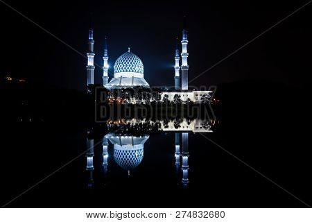 Night View Of The Blue Mosque With The Reflection In The Lake.