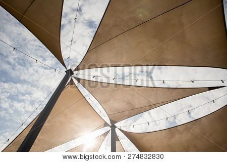 Canvas Tent With Decorative Light Bulb Hanging. View On The Cloudy Day.