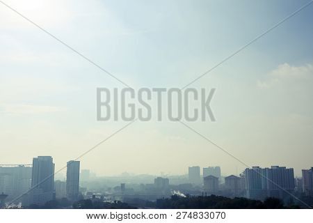 View Of Hazy Cityscape During The Day. Landscape Orientation. Poor Air Quality. Pollution.