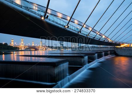 Water Dam At The Lake In Putrajaya With The Bridge Over It.