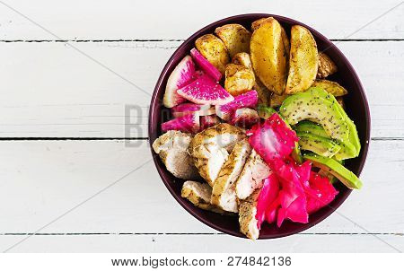 Buddha Bowl Dish With Chicken Fillet, Beked Potato, Avocado, Cabbage, Watermelon Radish And Chia See