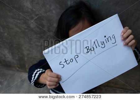 Girl With Stop Bullying Sign, Stop Bullying Concept. Bullying Is Unwanted And Aggressive Behavior. I