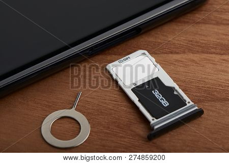 Sim Card And Microsd Card Tray With Removal Tool At The Side Of Smartphone