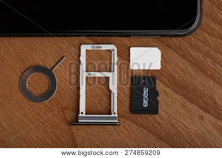 Sim Card And Microsd Card Tray With Removal Tool At The Side Of Smartphone
