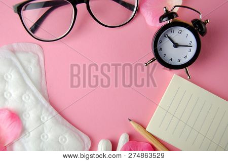 Women's Cycle Hyhienic Pads And Tampons On Pink Background. Copy Space.