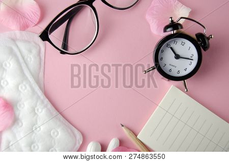 Women's Cycle Hyhienic Pads And Tampons On Pink Background. Copy Space.