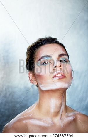 Beautiful Model. Stands In Profile, Makeup With Paint Strokes On The Face. Creative Person. Collarbo