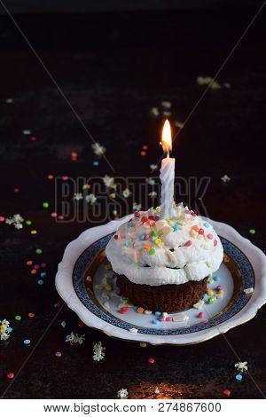 Chocolate Cupcake With Vanilla Cream And Candle. Happy Birthday. Dark Photo