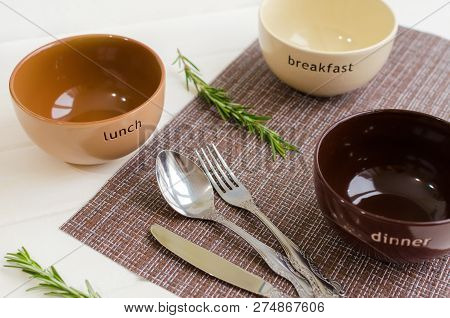 Set Of Bowls With Fork, Spoon And Knife. Written Breakfas, Lunch