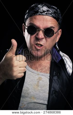 Rock star making facial expression and hand gesture