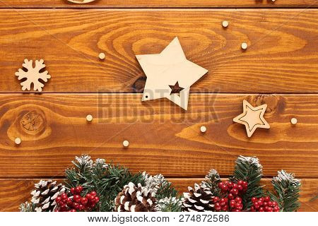 Spruce Branches, Cones And Red Berries On A White Wooden Background. Background For Christmas And Ne