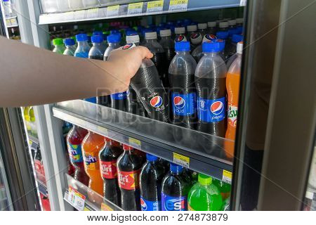 Bangkok, Thailand - December 19, 2018: Unidentified Customer Takes A Bottle Of Pepsi Max From The Re