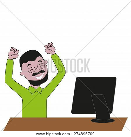 Happy And Laughing Bearded Man With Glasses In Front Of A Computer Monitor.
