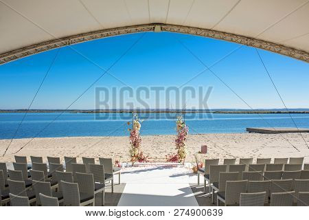 Event Decoration. Wedding Chuppa At Riverside Decorated With Fresh Flowers. Florist Workflow.