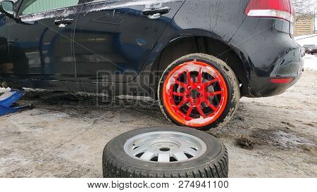 Winter Tire Fitting On The Street. Wheel Service, Tire Repair, And Changing Summer To Winter Tires. 